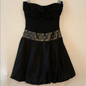 Black strapless dress with studded leather detail